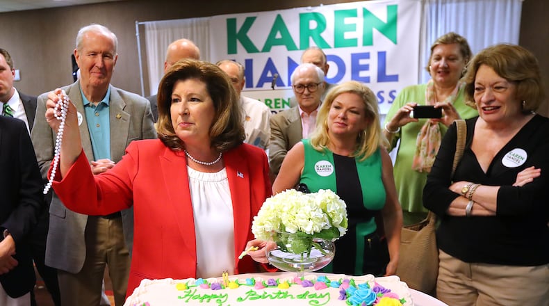 Republican candidate Karen Handel celebrates her birthday sharing a cake with her supporters during her election night viewing party in the special election for Georgia's 6th Congressional district at the DoubleTree Hotel on Tuesday, April 18, 2017, in Roswell. Curtis Compton/ccompton@ajc.com