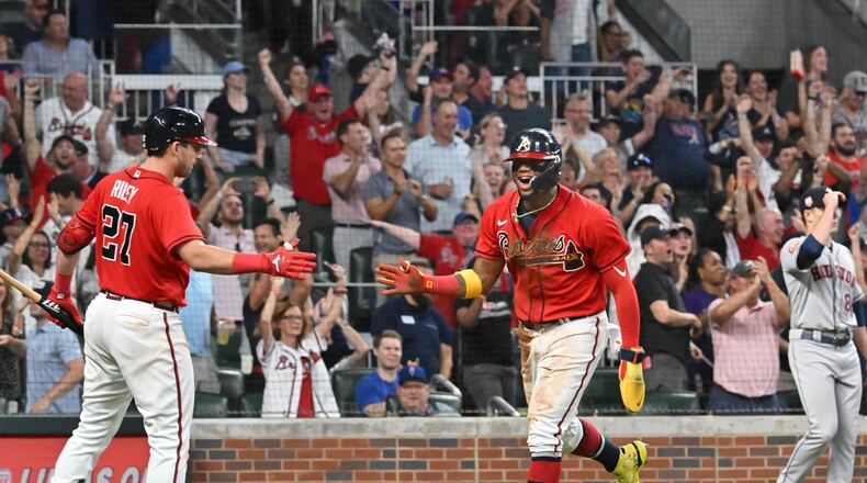Braves right fielder Ronald Acuña (right) is taking things day to day. (Hyosub Shin / Hyosub.Shin@ajc.com)