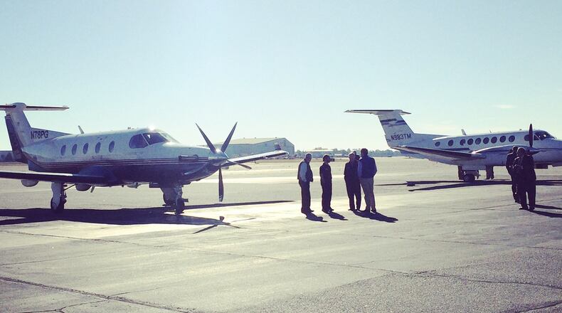 A pair of planes await for Georgia's Republican statewide candidates on a Macon tarmac (AJC/Daniel Malloy)