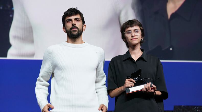 Directors Yuval Abraham, left, and Rachel Szor pose for photographers after accepting the special jury prize for the film 'Naza' during the closing ceremony of the 83rd edition of the Venice Film Festival in Venice, Italy, on Saturday, Sept. 12, 2026. (Photo by Scott A Garfitt/Invision/AP)