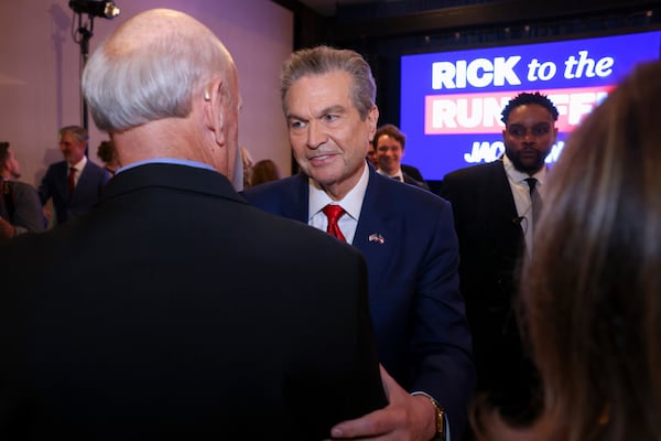 Rick Jackson (center), a Republican candidate for governor, greets a supporter at his election night party last month. (Jason Getz/AJC)