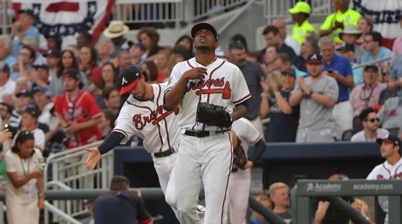 Braves starting pitcher Julio Teheran walks to the field before the home opener in SunTrust Park on Friday, April 14, 2017. (Hyosub Shin/hshin@ajc.com)