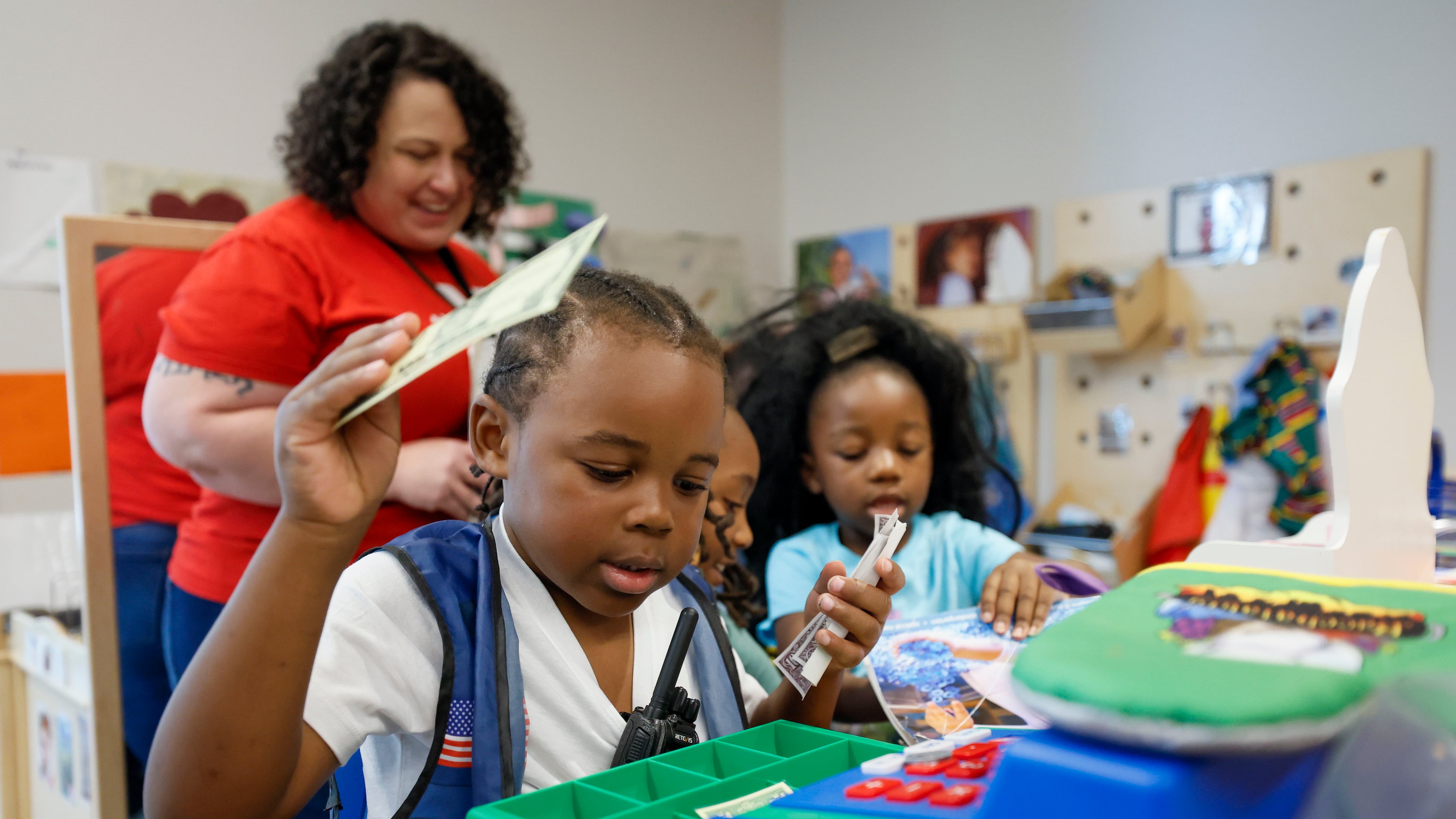 Children in the Head Start program engage in indoor activities with lead teacher Genesis Lavanway at the Arthur M. Blank Early Learning Center, where providers, parents and advocates celebrated the 60th birthday of the federal Head Start program on Monday, May 19, 2025. (Miguel Martinez/ AJC)
