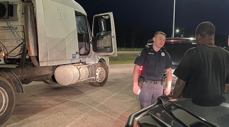 A trooper with the Georgia State Patrol speaks with a driver stopped during the holiday weekend.