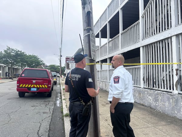 Falls River Fire Chief Jeffrey Bacon, right, speaks with another official after a fire the Gabriel House assisted living facility in Falls River, Mass., Monday, July 14, 2025. (AP Photo/Michael Casey)