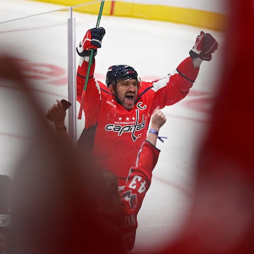 Washington Capitals left wing Alex Ovechkin (8) celebrates his 900th NHL career goal against the St. Louis Blues during the second period of an NHL hockey game, Wednesday, Nov. 5, 2025, in Washington. (AP Photo/John McDonnell)