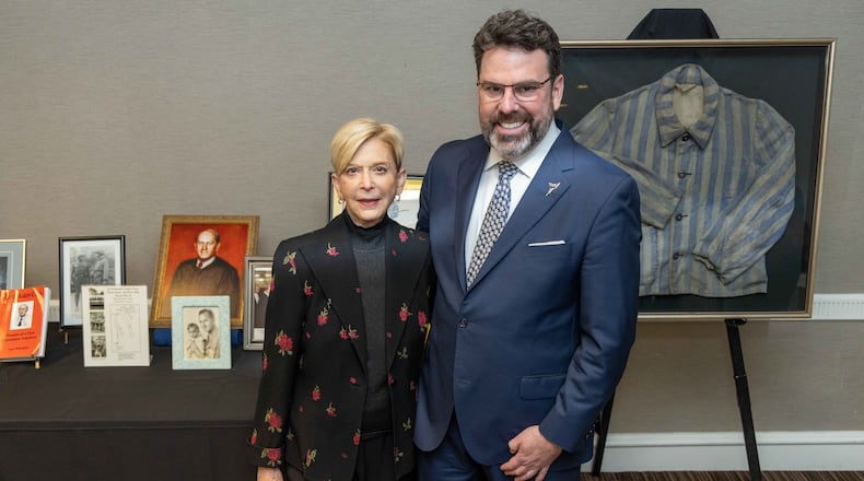 Portrait of Gail Cohn and Reuben Sloan,MD with artifacts from their father as they prepare to give a presentation to Resurgeons stockholders about their World War II connection at the Westin Atlanta at Perimeter. 
 PHIL SKINNER FOR THE ATLANTA JOURNAL-CONSTITUTION