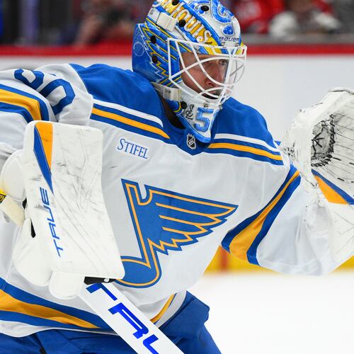 St. Louis Blues goaltender Jordan Binnington (50) stops a puck during the first period of an NHL hockey game against the Washington Capitals, Wednesday, Nov. 5, 2025, in Washington. (AP Photo/Nick Wass)