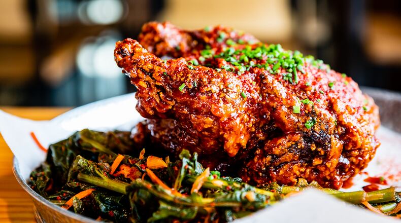 Boxcar's Korean Fried Chicken is fried whole and served coated in a spicy, savory gochujang sauce.