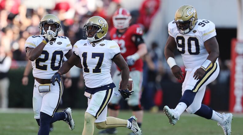 Georgia Tech defensive backs Lance Austin (center) and Lawrence Austin (left). (Curtis Compton/ccompton@ajc.com)