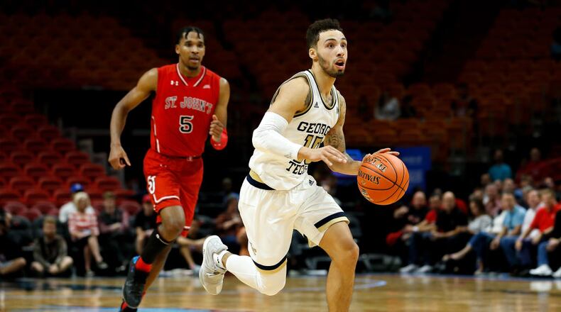 MIAMI, FL - DECEMBER 01: Jose Alvarado #10 of the Georgia Tech Yellow Jackets drives to the basket against Justin Simon #5 of the St. John's Red Storm during the HoopHall Miami Invitational at American Airlines Arena on December 1, 2018 in Miami, Florida. (Photo by Michael Reaves/Getty Images)