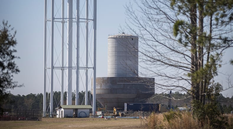 A water tower under construction, center, at the edge of the Hyundai electric vehicle factory site that will be used to hold groundwater pumped from Bulloch County is shown on Wednesday, Feb. 21, 2024, Ellabell, Ga. (AJC Photo/Stephen B. Morton)