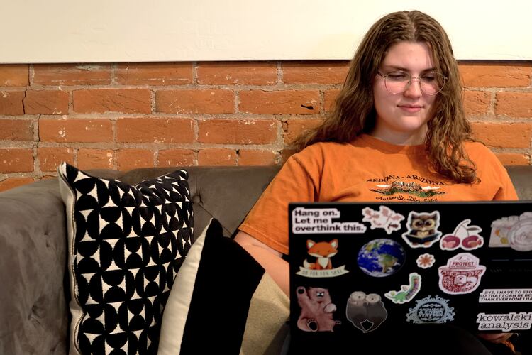 Zoe Lloyd, a 21-year-old student at Northern Arizona University, works from her laptop at Sosta in Flagstaff, Ariz., on Monday, April 20 2026. (AP Photo/Cheyanne Mumphrey)