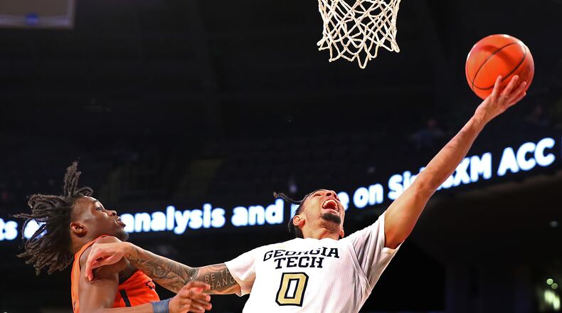 012322 Atlanta: Georgia Tech guard Michael Devoe goes to the basket for two agains Clayton State forward Ricardo Lynch in a NCAA college basketball game on Sunday, Jan. 23, 2022, in Atlanta. “Curtis Compton / Curtis.Compton@ajc.com”`