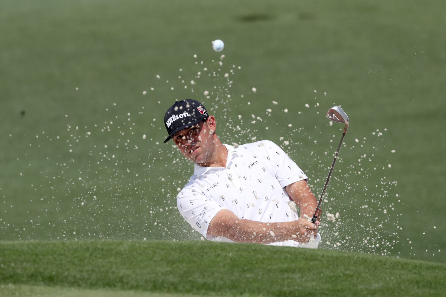 April 7, 2021, Augusta: Gary Woodland hits out of the bunker on the second hole during his practice round for the Masters at Augusta National Golf Club on Wednesday, April 7, 2021, in Augusta. Curtis Compton/ccompton@ajc.com