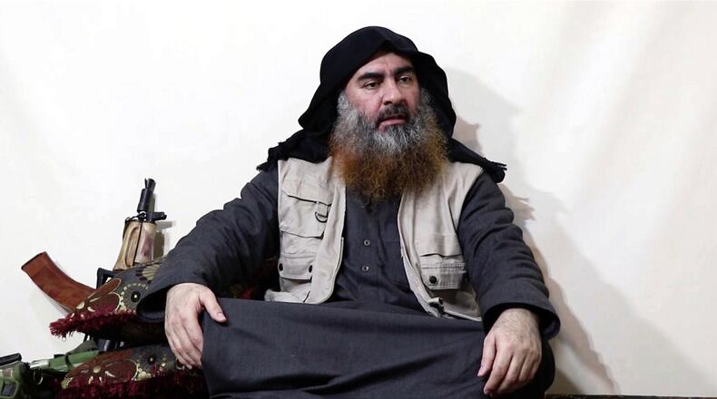 FILE - This file image made from video posted on a militant website April 29, 2019, purports to show the leader of the Islamic State group, Abu Bakr al-Baghdadi, being interviewed by his group's Al-Furqan media outlet.