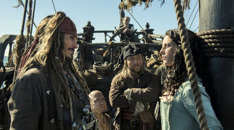 Johnny Depp portrays Jack Sparrow, left, and Kaya Scodelario portrays Carina Smyth, right, in “Pirates of the Caribbean: Dead Men Tell No Tales.” Contributed by Peter Mountain/Disney