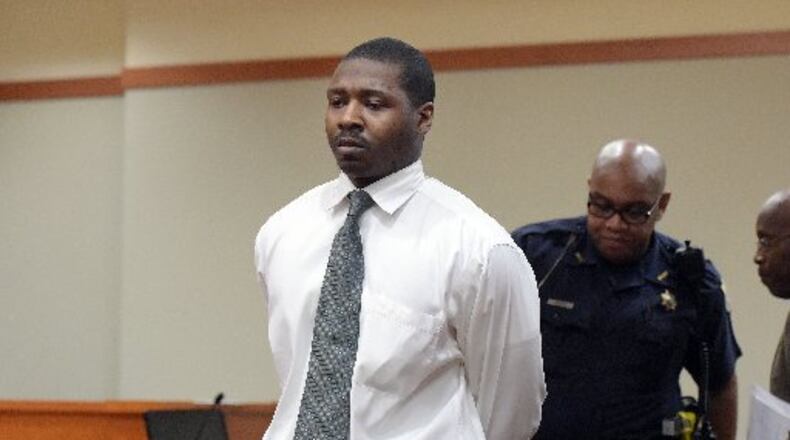 Purported gang member Darrius Aderhold, leaves the courtroom after sentencing that will put him behind bars for life. KENT D. JOHNSON/KDJOHNSON@AJC.COM