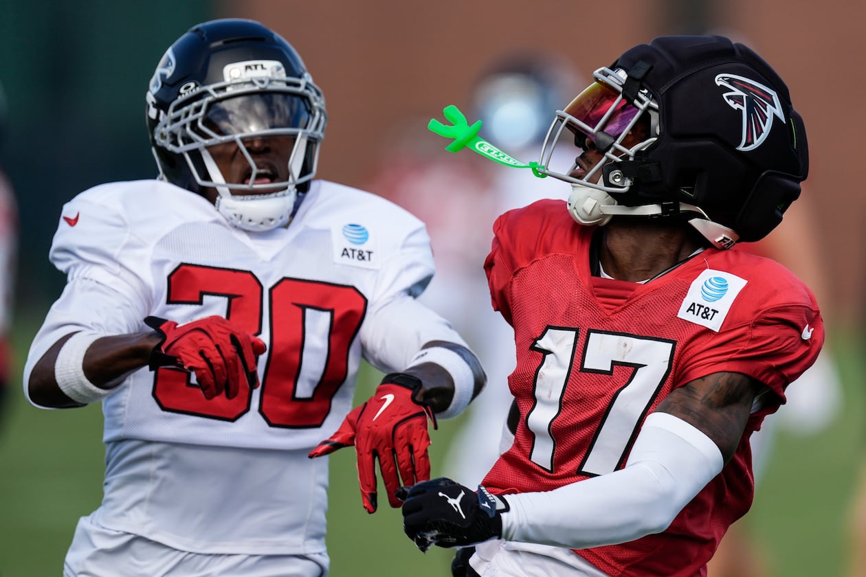 The Falcons' Zachariah Branch (17) works for a catch against Darnay Holmes during training camp Monday, Aug. 3, 2026, in Flowery Branch. (Mike Stewart/AP)