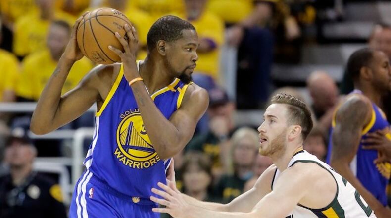 Utah Jazz forward Gordon Hayward (20) guards Golden State Warriors forward Kevin Durant (35) in the second half during Game 4 of the NBA basketball second-round playoff series Monday, May 8, 2017, in Salt Lake City. The Warriors completed a second-round sweep of the Utah Jazz with a 121-95 victory. (AP Photo/Rick Bowmer)
