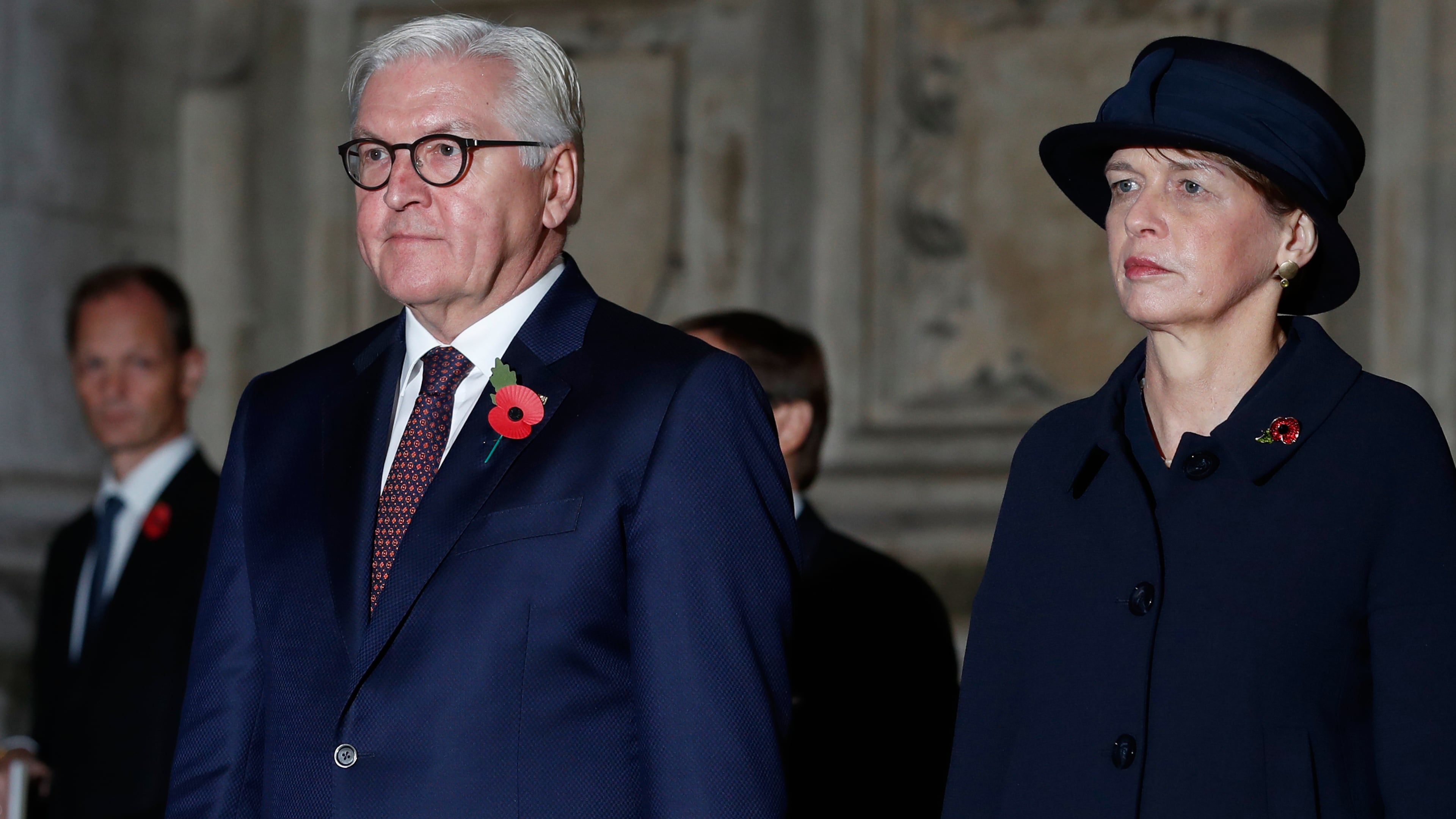 FILE - German President Frank-Walter Steinmeier, front left, and his wife, Elke Budenbender, right, leave Westminster Abbey in London, England, Nov. 11, 2018. (AP Photo/Alastair Grant, File)