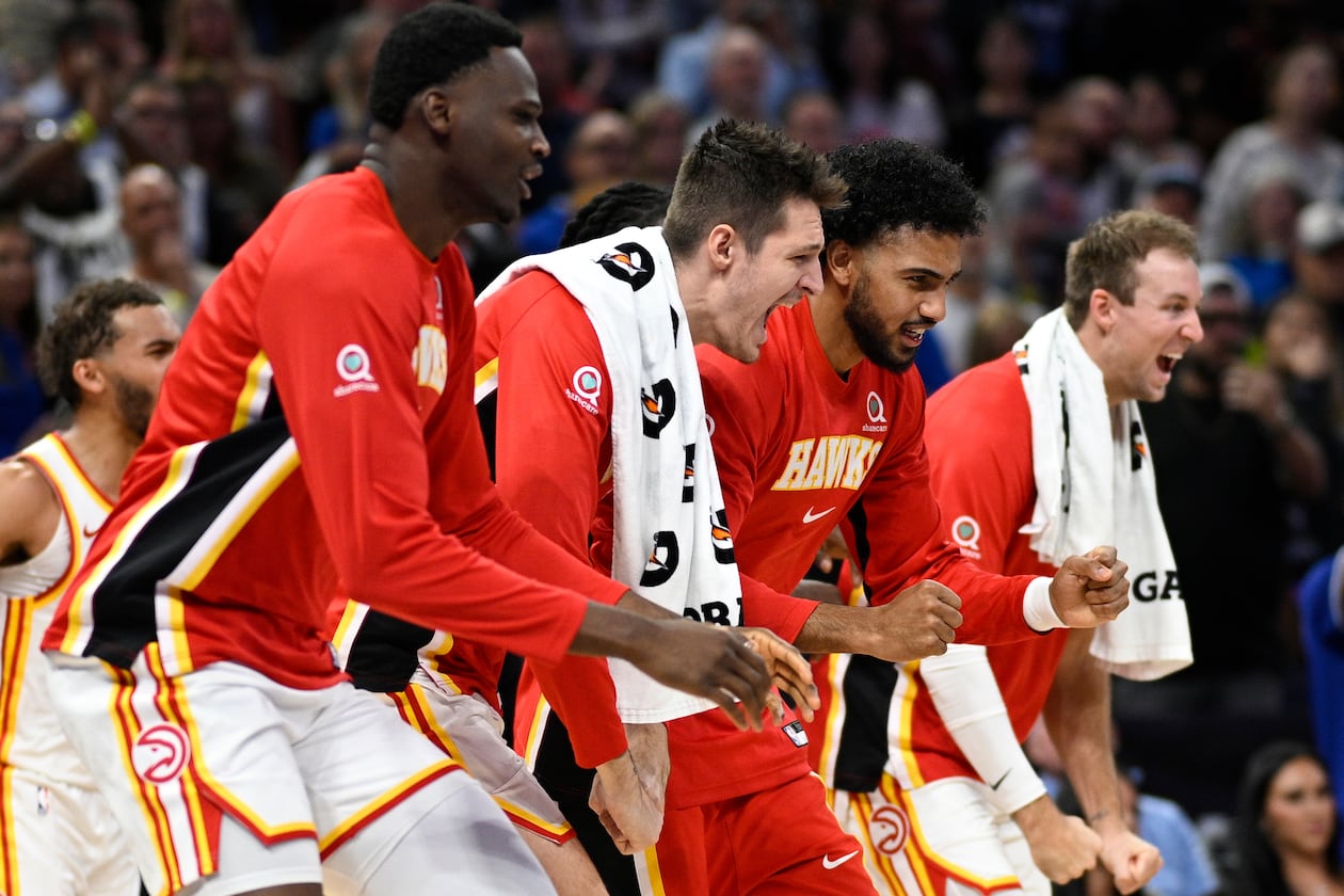 Hawks center N’Faly Dante (from left), guard Vit Krejci, forward Jacob Toppin and guard Luke Kennard celebrate after a defensive play against the Magic on Friday, Oct. 24, 2025, in Orlando, Fla. Their schedule over the next two weeks includes four games in seven days and a West Coast road trip. (Phelan M. Ebenhack/AP)