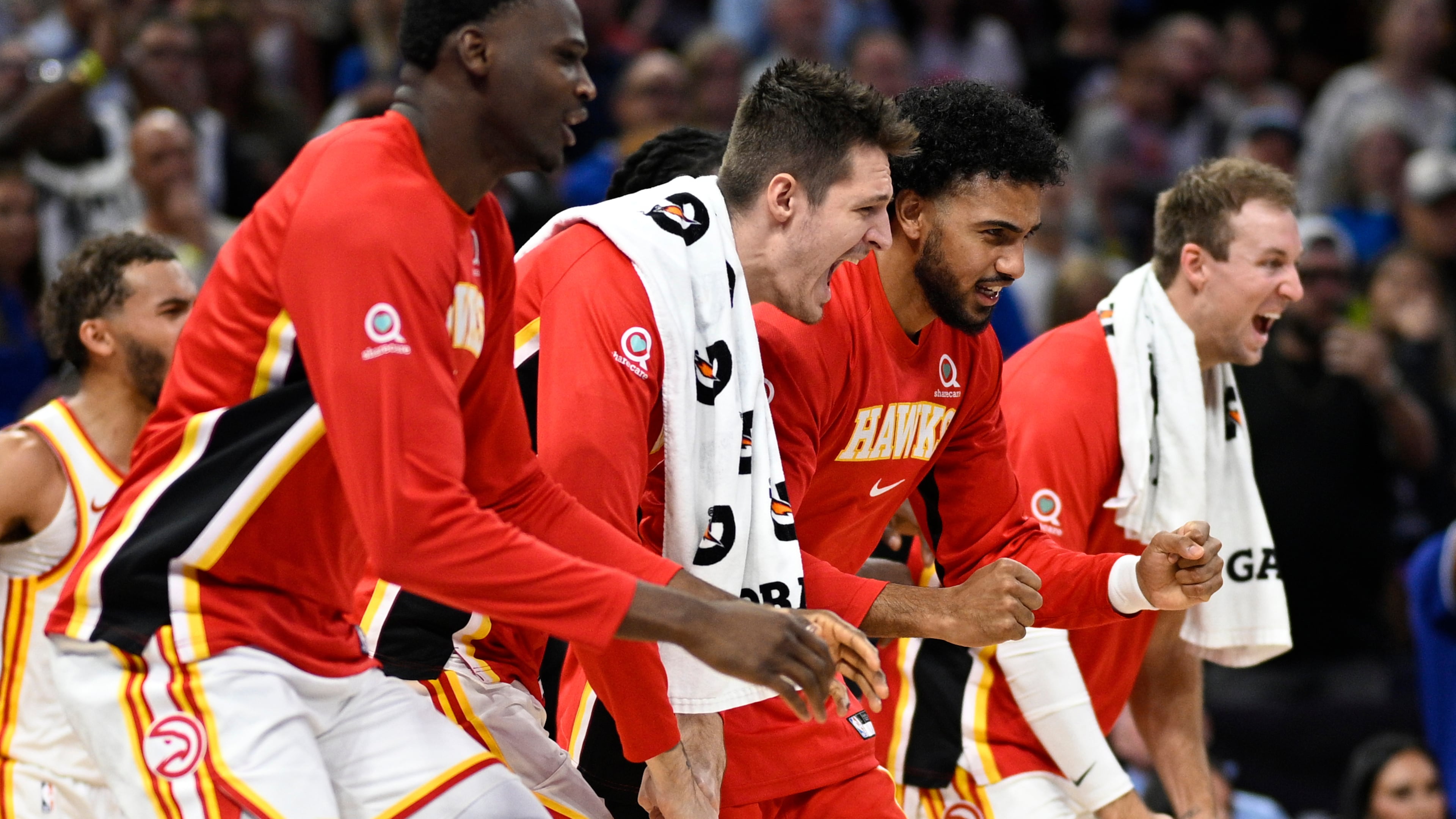 Hawks center N’Faly Dante (from left), guard Vit Krejci, forward Jacob Toppin and guard Luke Kennard celebrate after a defensive play against the Magic on Friday, Oct. 24, 2025, in Orlando, Fla. Their schedule over the next two weeks includes four games in seven days and a West Coast road trip. (Phelan M. Ebenhack/AP)
