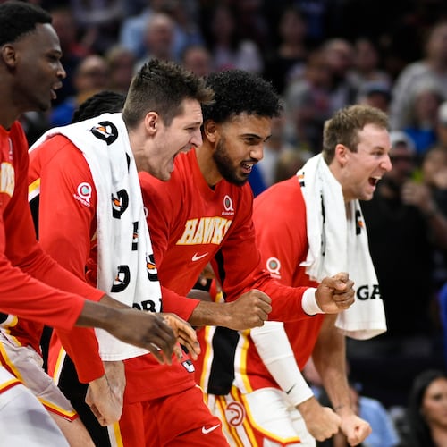 Hawks center N’Faly Dante (from left), guard Vit Krejci, forward Jacob Toppin and guard Luke Kennard celebrate after a defensive play against the Magic on Friday, Oct. 24, 2025, in Orlando, Fla. Their schedule over the next two weeks includes four games in seven days and a West Coast road trip. (Phelan M. Ebenhack/AP)