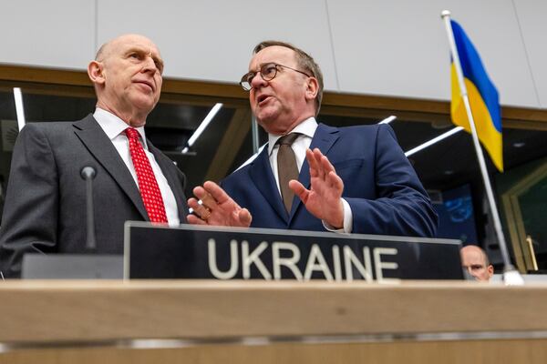 Britain's Defense Secretary John Healey, left, talks with Germany's Defense Minister Boris Pistorius during a meeting of the Ukraine Defense Contact Group at NATO headquarters in Brussels, Friday, April 11, 2025. (AP Photo/Geert Vanden Wijngaert)