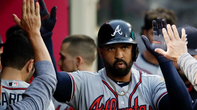 Atlanta Braves' Matt Kemp celebrates in the dugout after a home run against the Los Angeles Angels during the second inning of a baseball game in Anaheim, Calif., Wednesday, May 31, 2017. (AP Photo/Chris Carlson)
