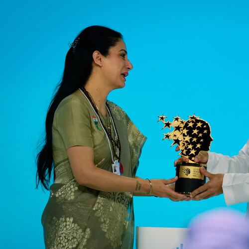 Indian teacher Rouble Nagi, left, receives the Global Teacher Prize trophy from Dubai Crown Prince Sheikh Hamdan bin Mohammed Al Maktoum, at a ceremony in Dubai, United Arab Emirates, Thursday, Feb. 5, 2026. (AP Photo/Altaf Qadri)