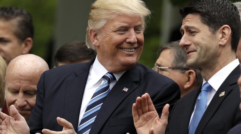 In this May 4, 2017, photo, President Donald Trump talks to House Speaker Paul Ryan of Wis. in the Rose Garden of the White House in Washington, after the House pushed through a health care bill. (AP Photo/Evan Vucci)