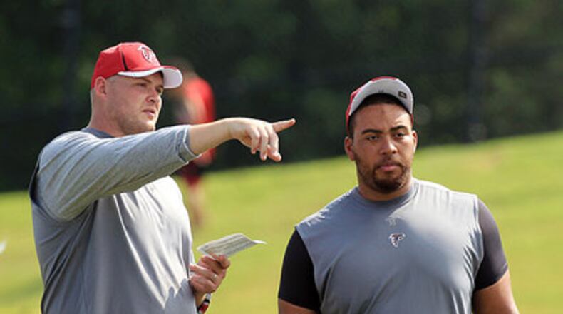 FILE PHOTO -- 110801 Flowery Branch - Offensive tackle Tyson Clabo, left, and offensive guard Justin Blalock, right, who just signed a contract with the Falcons, watch practice but are not yet able to participate while players run through the first padded practice at training camp in Flowery Branch on Monday, August 1, 2011. Curtis Compton ccompton@ajc.com FILE PHOTO -- 110801 Flowery Branch - Offensive tackle Tyson Clabo, left, and offensive guard Justin Blalock, right, who just signed a contract with the Falcons, watch practice but are not yet able to participate while players run through the first padded practice at training camp in Flowery Branch on Monday, August 1, 2011. Curtis Compton ccompton@ajc.com