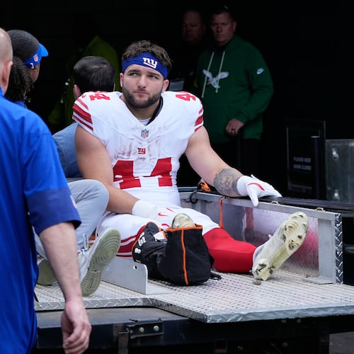 New York Giants running back Cam Skattebo (44) leaves the field after an injury during the first half of an NFL football game against the Philadelphia Eagles on Sunday, Oct. 26, 2025, in Philadelphia. (AP Photo/Chris Szagola)