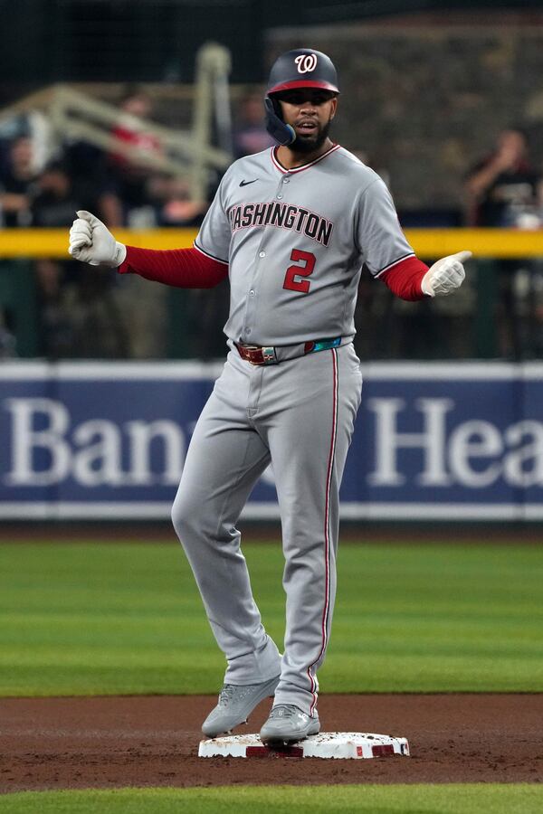 Washington Nationals' Luis García Jr. celebrates after hitting a two-run double against the Arizona Diamondbacks in the first inning during a baseball game, Saturday, May 31, 2025, in Phoenix. (AP Photo/Rick Scuteri)