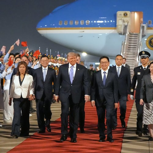 President Donald Trump walks with China's Vice President Han Zheng during a welcome ceremony Wednesday, May 13, 2026, at Beijing Capital International Airport in Beijing. (AP Photo/Mark Schiefelbein)
