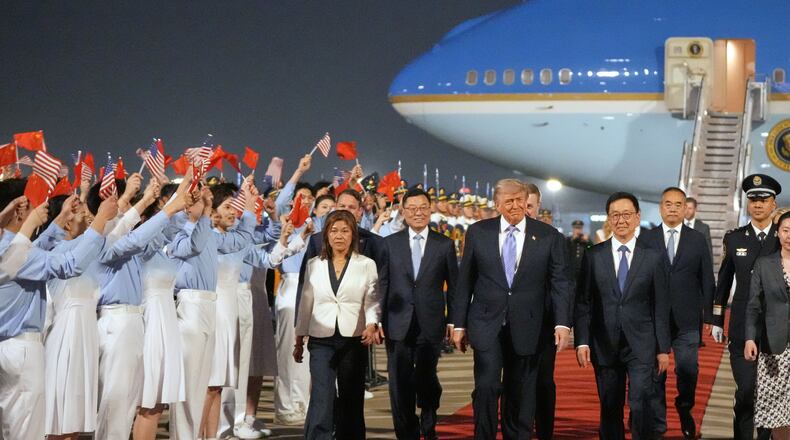 President Donald Trump walks with China's Vice President Han Zheng during a welcome ceremony Wednesday, May 13, 2026, at Beijing Capital International Airport in Beijing. (AP Photo/Mark Schiefelbein)