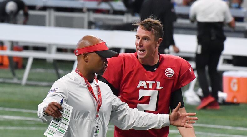 Falcons general manager Terry Fontenot and quarterback Matt Ryan (2) talk as they leave the field after the 2021 AT&T Atlanta Falcons Training Camp: Dirty Birds Open Practice at the Mercedes-Benz Stadium on Saturday, August 7, 2021. (Hyosub Shin / Hyosub.Shin@ajc.com)