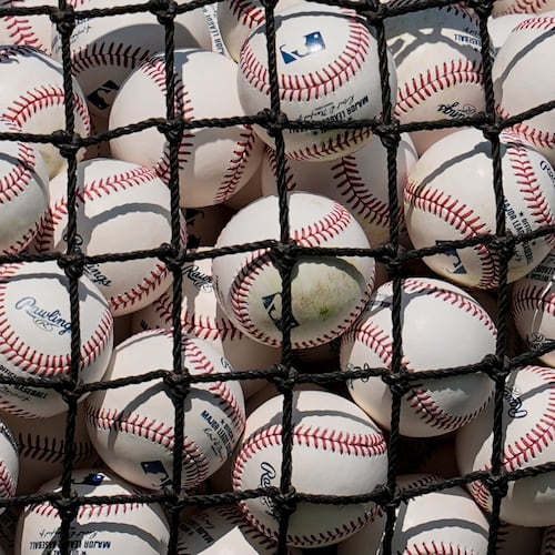 MLB baseballs are seen before a baseball game between the Atlanta Braves and the St. Louis Cardinals, Tuesday, June 30, 2026, in Atlanta. (AP Photo/Mike Stewart)