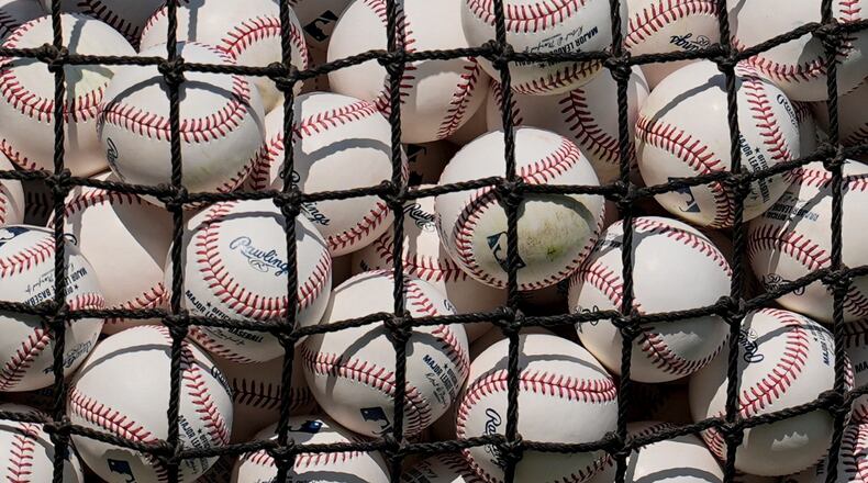 MLB baseballs are seen before a baseball game between the Atlanta Braves and the St. Louis Cardinals, Tuesday, June 30, 2026, in Atlanta. (AP Photo/Mike Stewart)