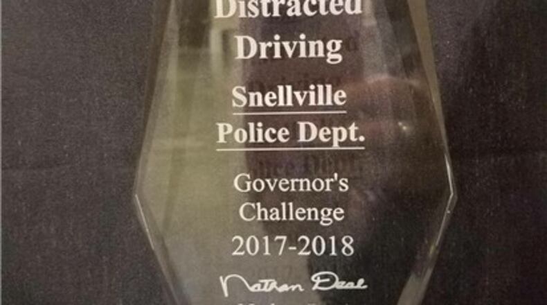 The Snellville Police Department was recognized recently at the 19th Annual Governor’s Challenge Awards as the top agency in the state for its efforts to educate the public about the dangers of distracted driving and enforcement of distracted driving laws. Courtesy City of Snellville