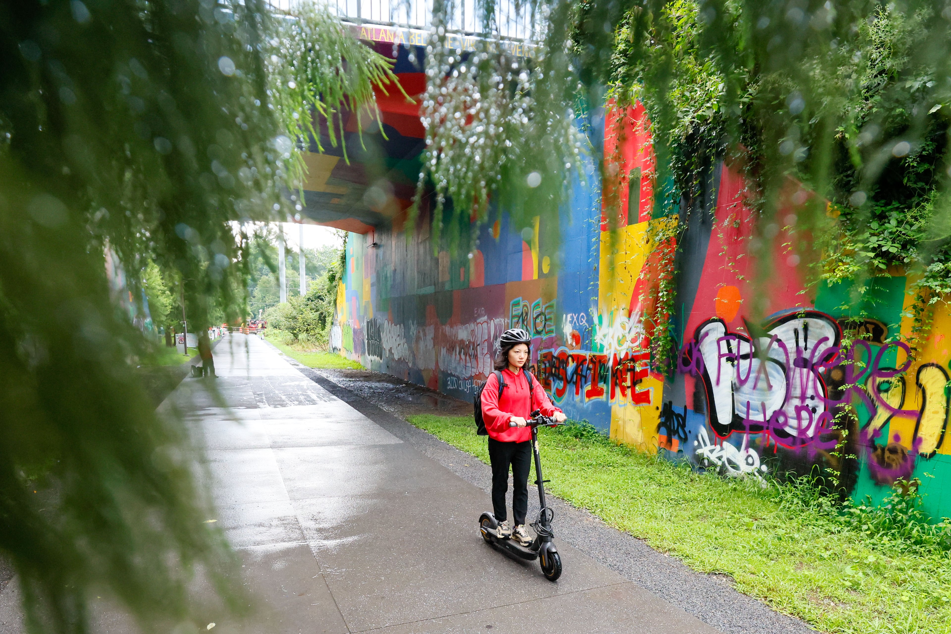 Mona Su, who lives in Midtown, was seen riding her scooter along the beltline on her way home on Monday, July 22, 2024. For Mona Su, riding scooters is a car-free lifestyle that provides an easy and reliable commuting alternative.
(Miguel Martinez / AJC)