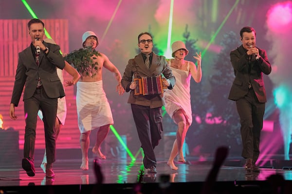 KAJ from Sweden performs the song "Bara Bada Bastu" during the first semi-final of the 69th Eurovision Song Contest, in Basel, Switzerland, Tuesday, May 13, 2025. (AP Photo/Martin Meissner)