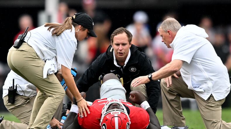 Georgia's offensive lineman Amarius Mims (65) gets injured during the first half in an NCAA football game at Sanford Stadium, Saturday, September 16, 2023, in Athens. Georgia won 24 - 14 over South Carolina. (Hyosub Shin / Hyosub.Shin@ajc.com)