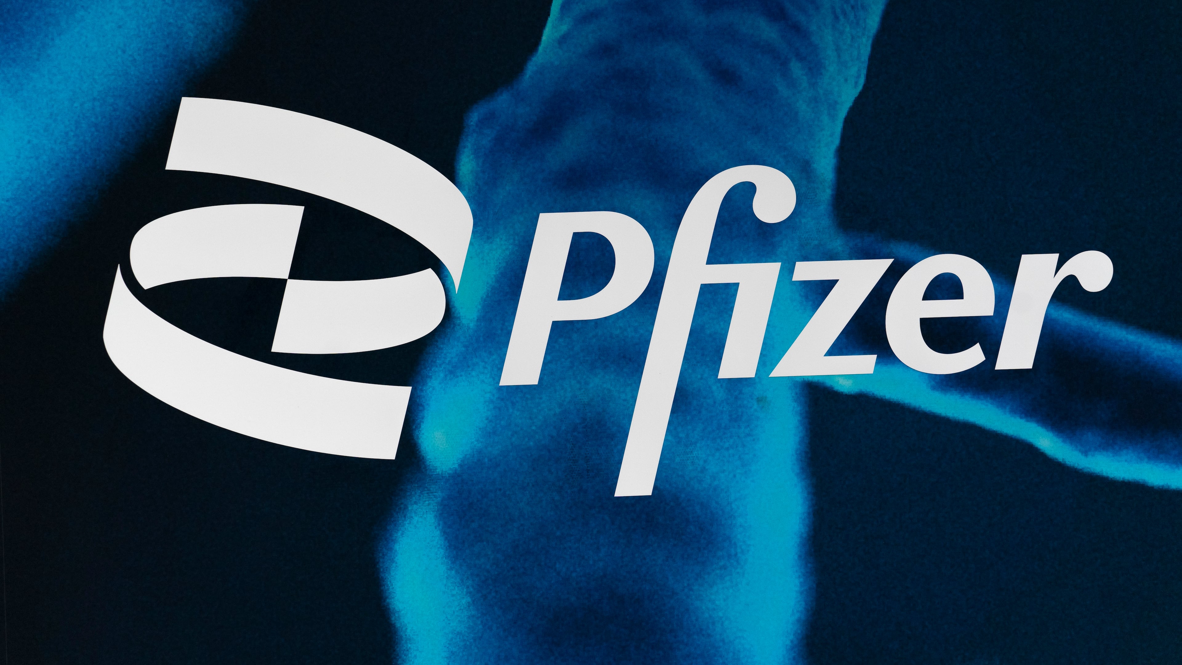 FILE - The Pfizer logo is displayed at the company's headquarters, Friday, Feb. 5, 2021, in New York. (AP Photo/Mark Lennihan, File)