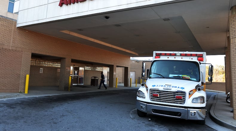 Clayton County ambulances line up in the driveway outside the emergency room of the Southern Regional Medical Center in Riverdale. KENT D. JOHNSON/ KDJOHNSON@AJC.COM