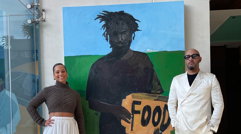 Alicia Keys and Swizz Beats with Henry Taylor's "Cornerstone." Photo by Cole Cook