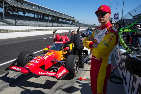 Josef Newgarden watches from the pit area before the start practice for the Indianapolis 500 auto race at Indianapolis Motor Speedway in Indianapolis, Friday, May 23, 2025. (AP Photo/Michael Conroy)