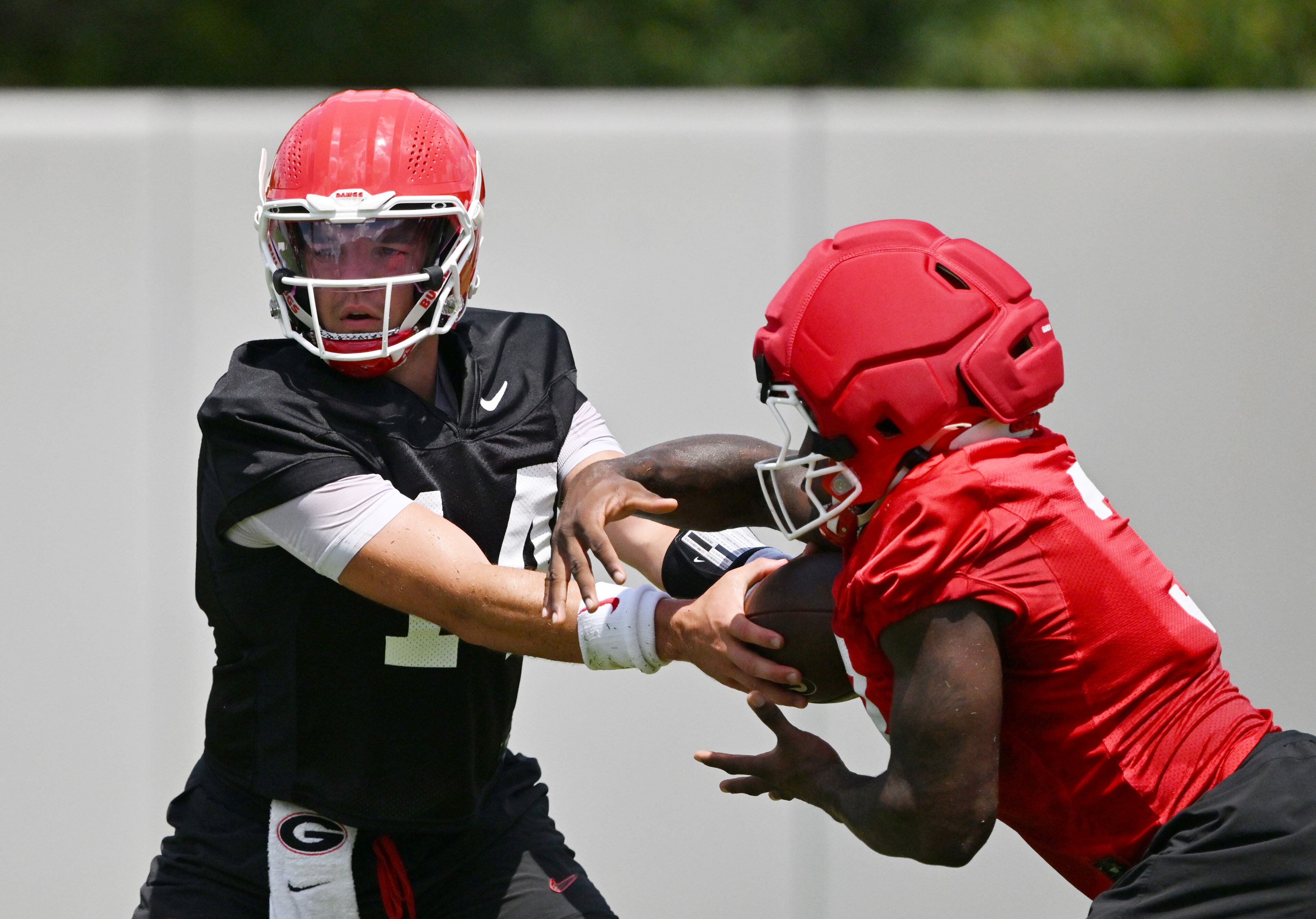 Georgia quarterback Gunner Stockton (14) runs a drill during a football practice at the University of Georgia practice facility, Thursday, July 31, 2025, in Athens. (Hyosub Shin / AJC)