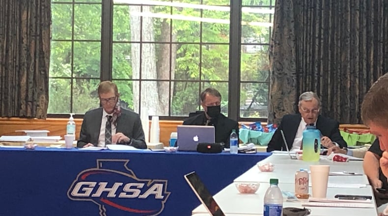 (L-R) GHSA president Glenn White, executive director Robin Hines and attorney Alan Connell listen to arguments at the Valdosta appeal before the GHSA board of trustees.